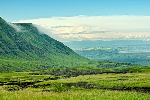 A sweeping view of the Rift Valley, showcasing its dramatic, expansive landscape with rolling hills and distant escarpments.